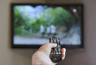 Remote control pointed at TV