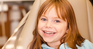 Little girl smiling in dental chair