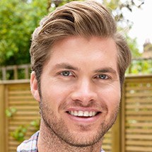 Young man with healthy smile outdoors